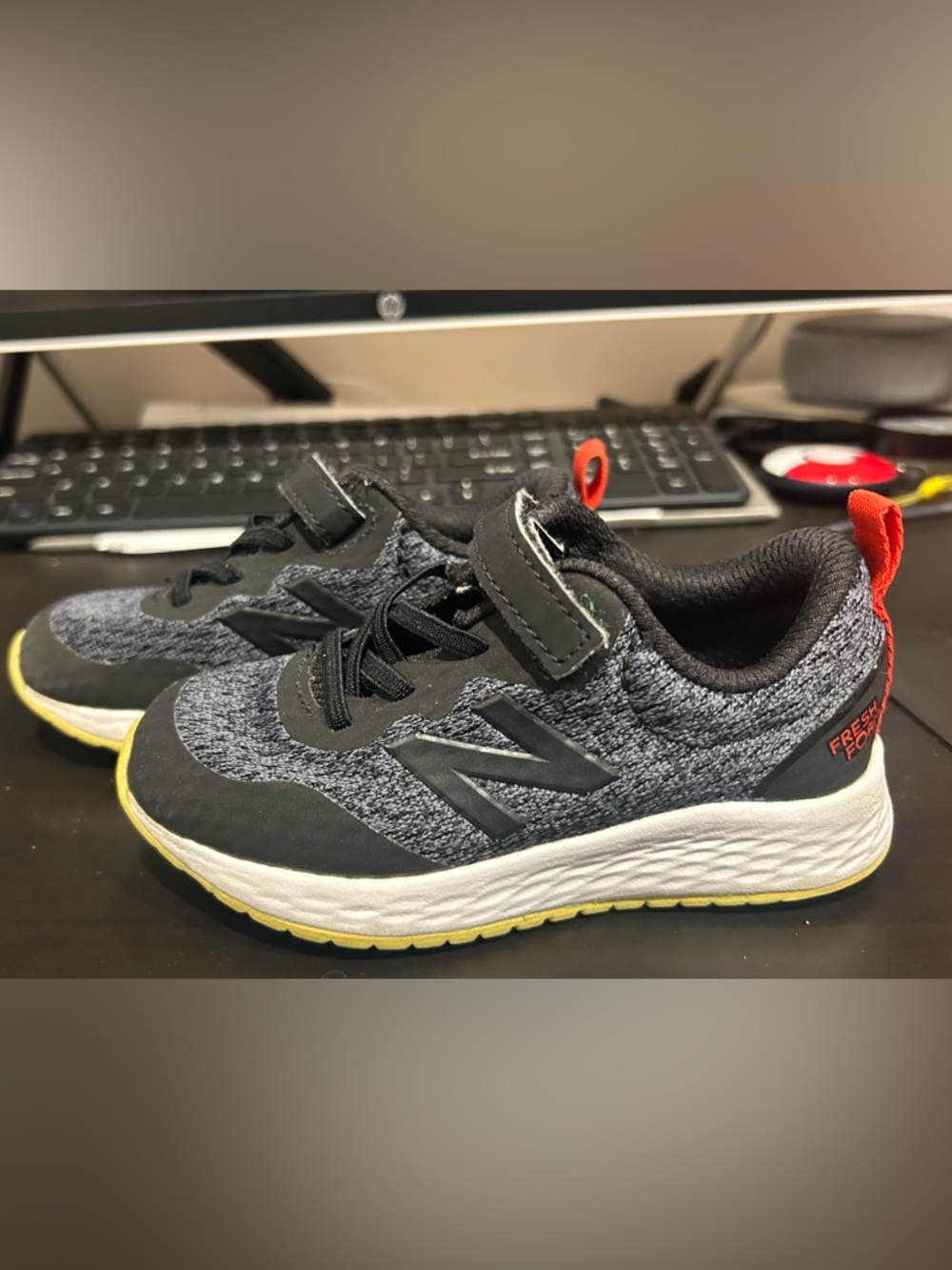 New Balance Toddler Gray and Black Sneakers with Yellow Sole and Red Pull Tab